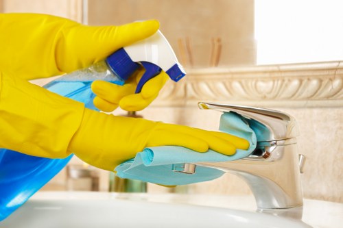 Technician wearing PPE during professional carpet cleaning